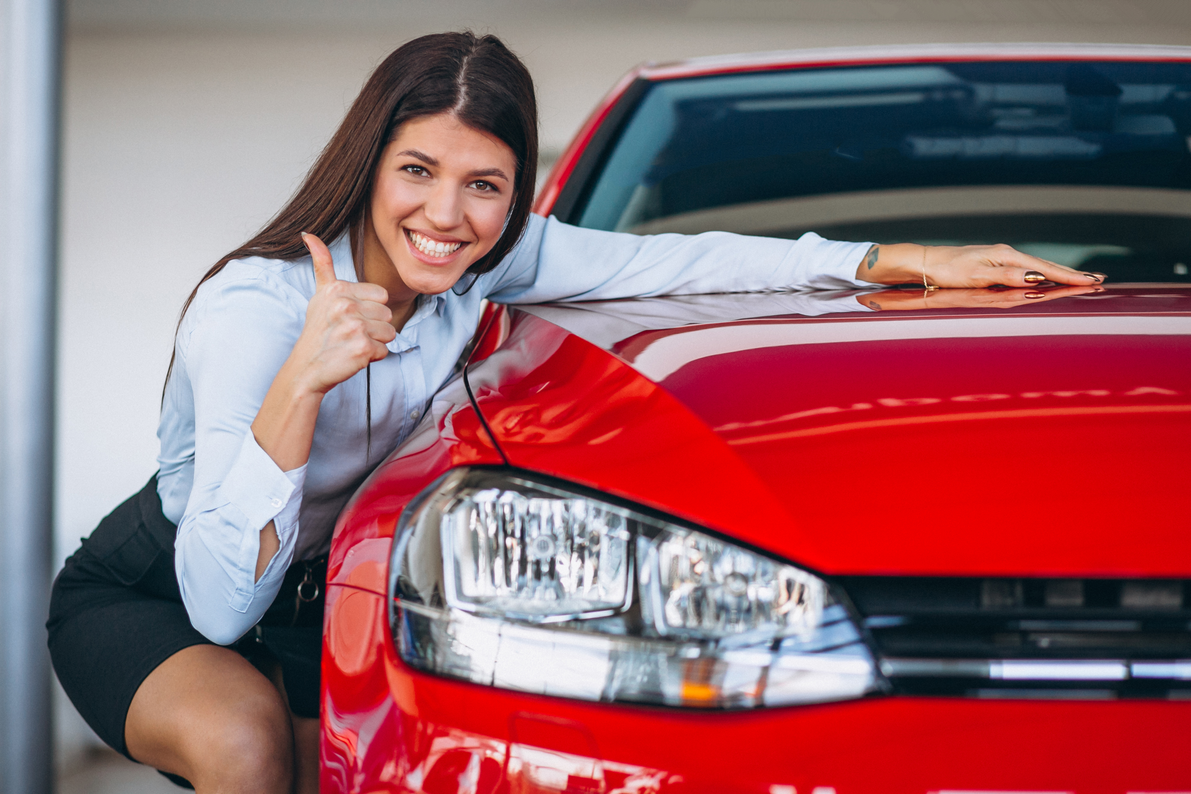 Young woman buying a car